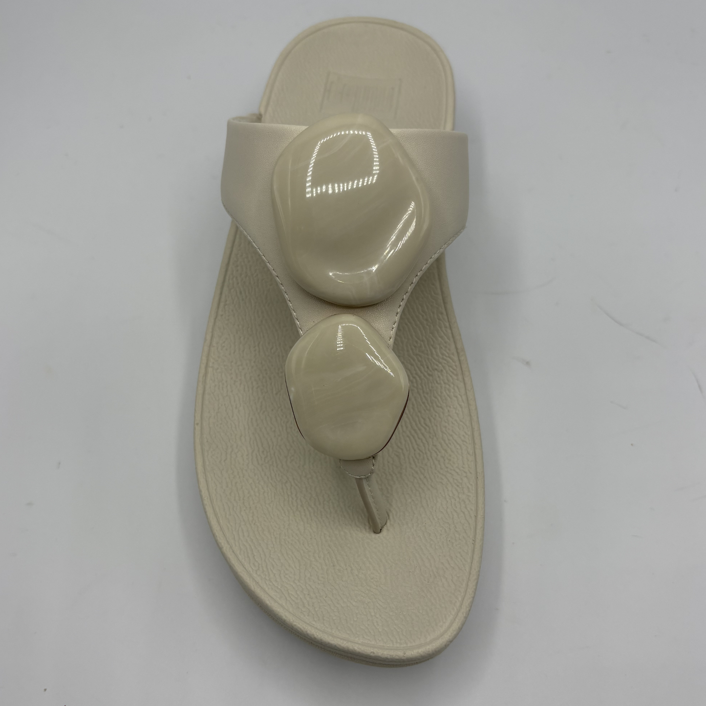 Beige sandal on a white background