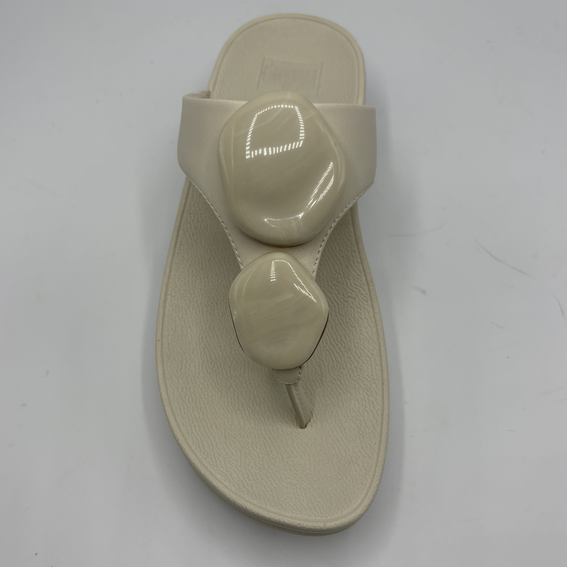 Beige sandal on a white background