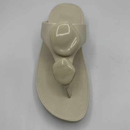 Beige sandal on a white background