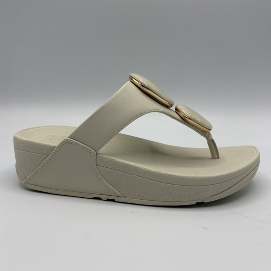 Beige sandal with a thick sole on a white background