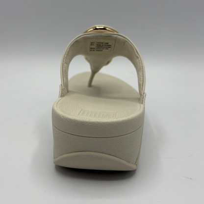 Beige sandal on a white background