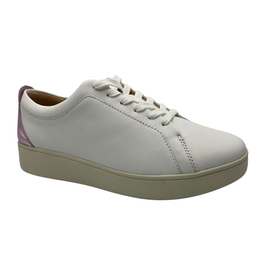 45 degree angled view of white leather sneakers with white laces, rubber outsole and metallic lilac detail on heel