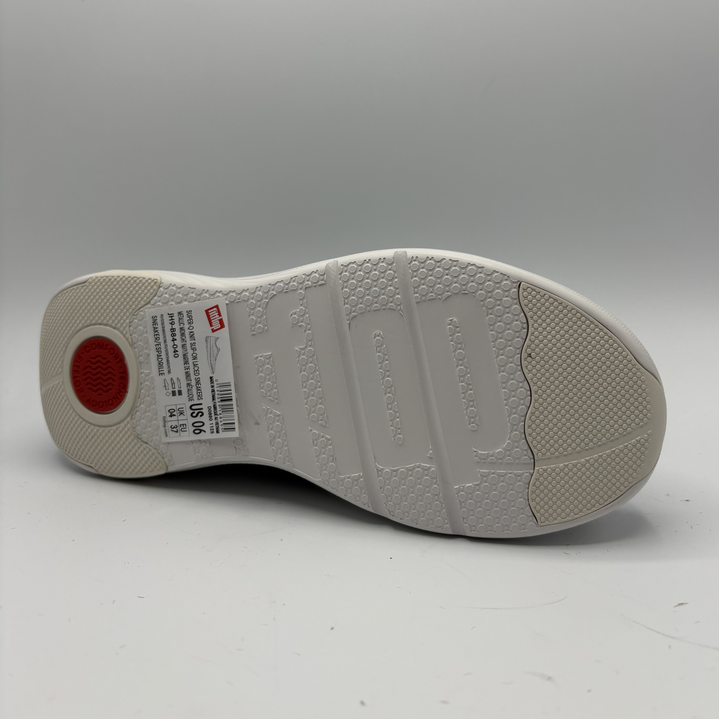 White sneaker sole with brand logo on a gray background