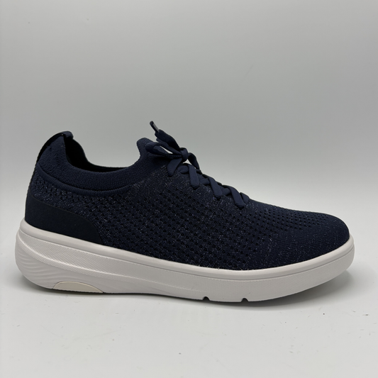 Navy blue sneaker with white sole on a light gray background