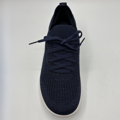 Navy blue sneaker with white sole on a light gray background