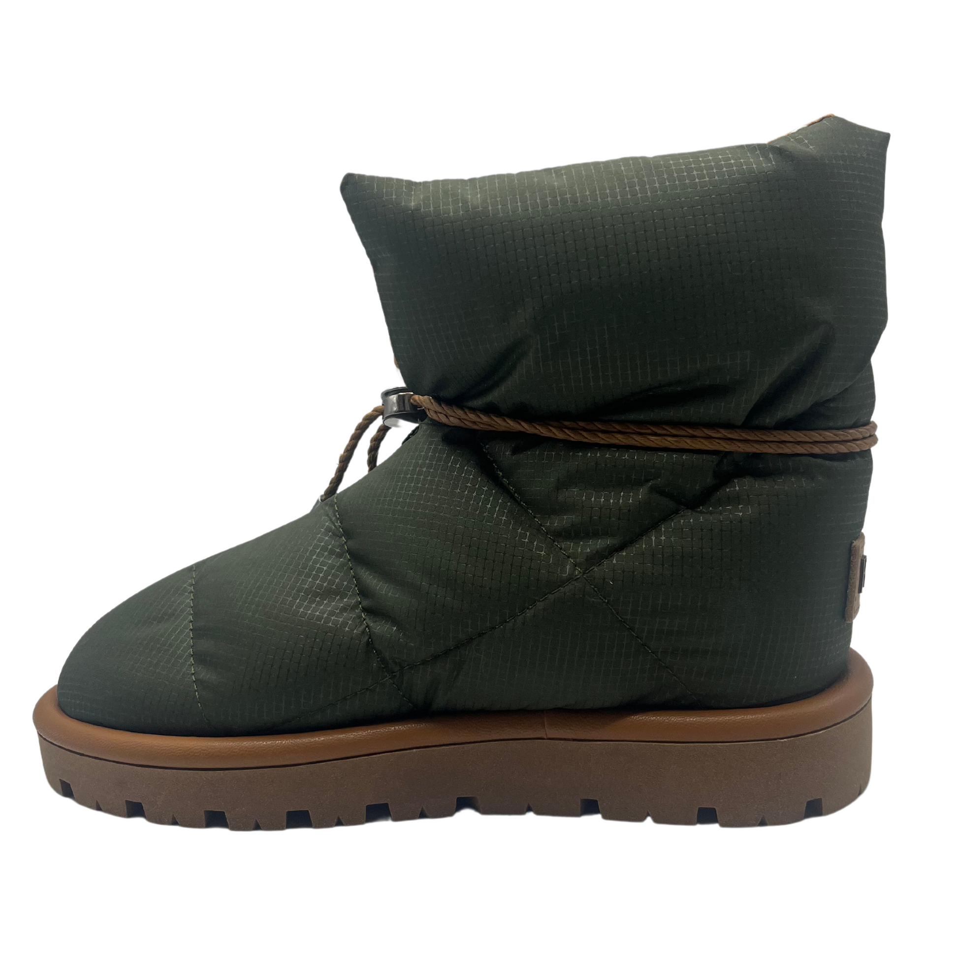 Left facing view of khaki coloured puffer boot with brown rubber outsole