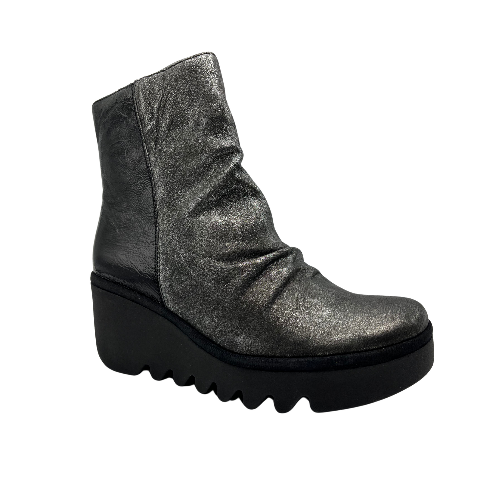 45 degree angled view of dark silver leather bootie with wedge heel and side zipper closure
