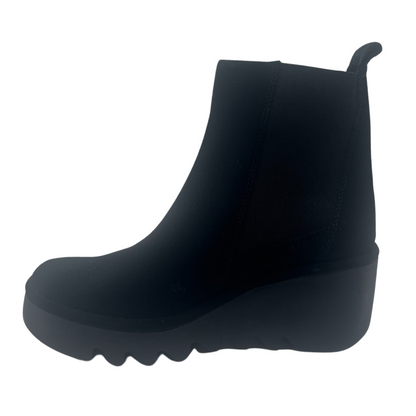 Left facing view of black suede short boot with chunky wedge heel