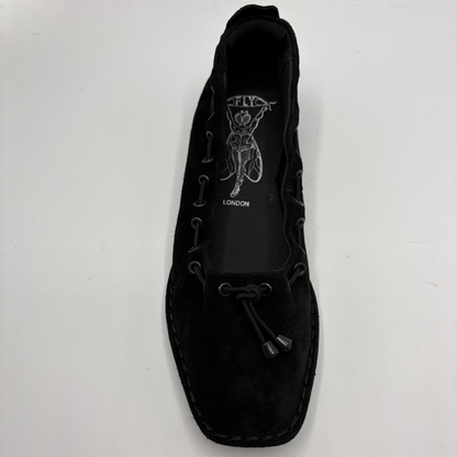 Black ballet flat with branding on a white background