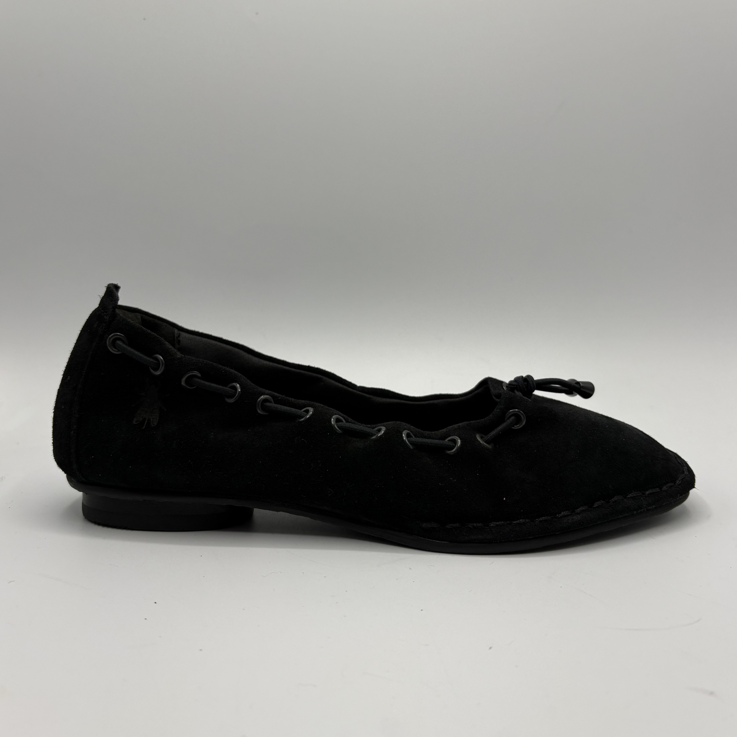 Black flat shoe on a white background