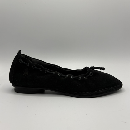 Black flat shoe on a white background