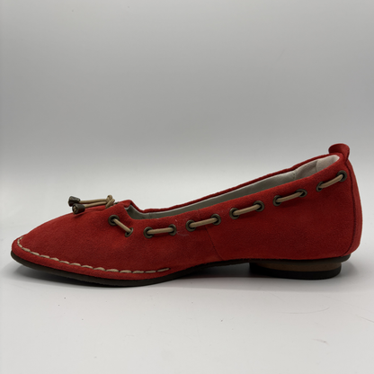 Red flat shoe on a white background