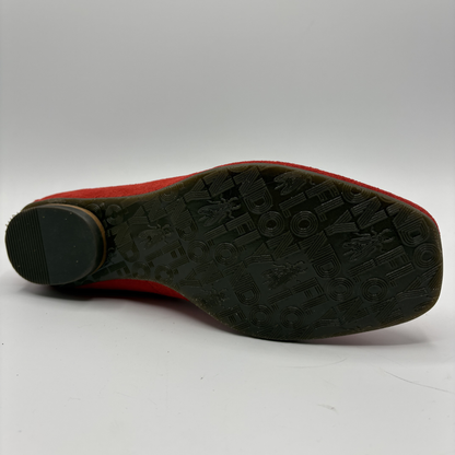 Black sole of a shoe with red upper on a white background