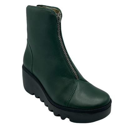 45 degree angled view of green leather ankle boot with zipper closure up the center