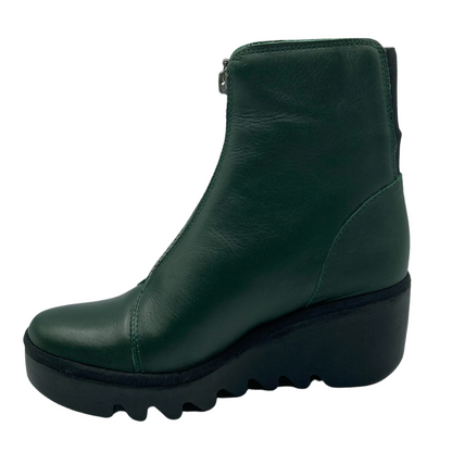 Left facing view of green leather ankle boot with chunky black wedge heel