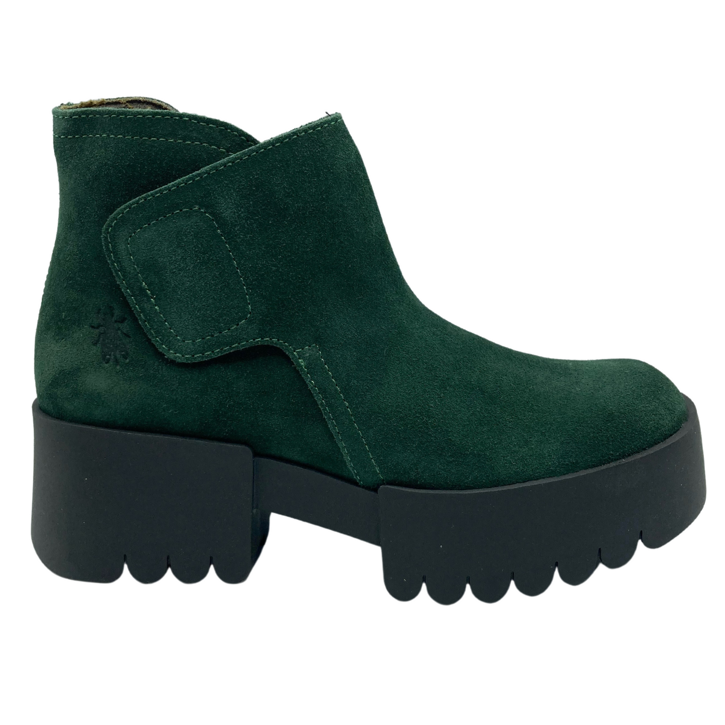 Right facing view of green suede ankle boot with velcro closure and chunky black cleated heel