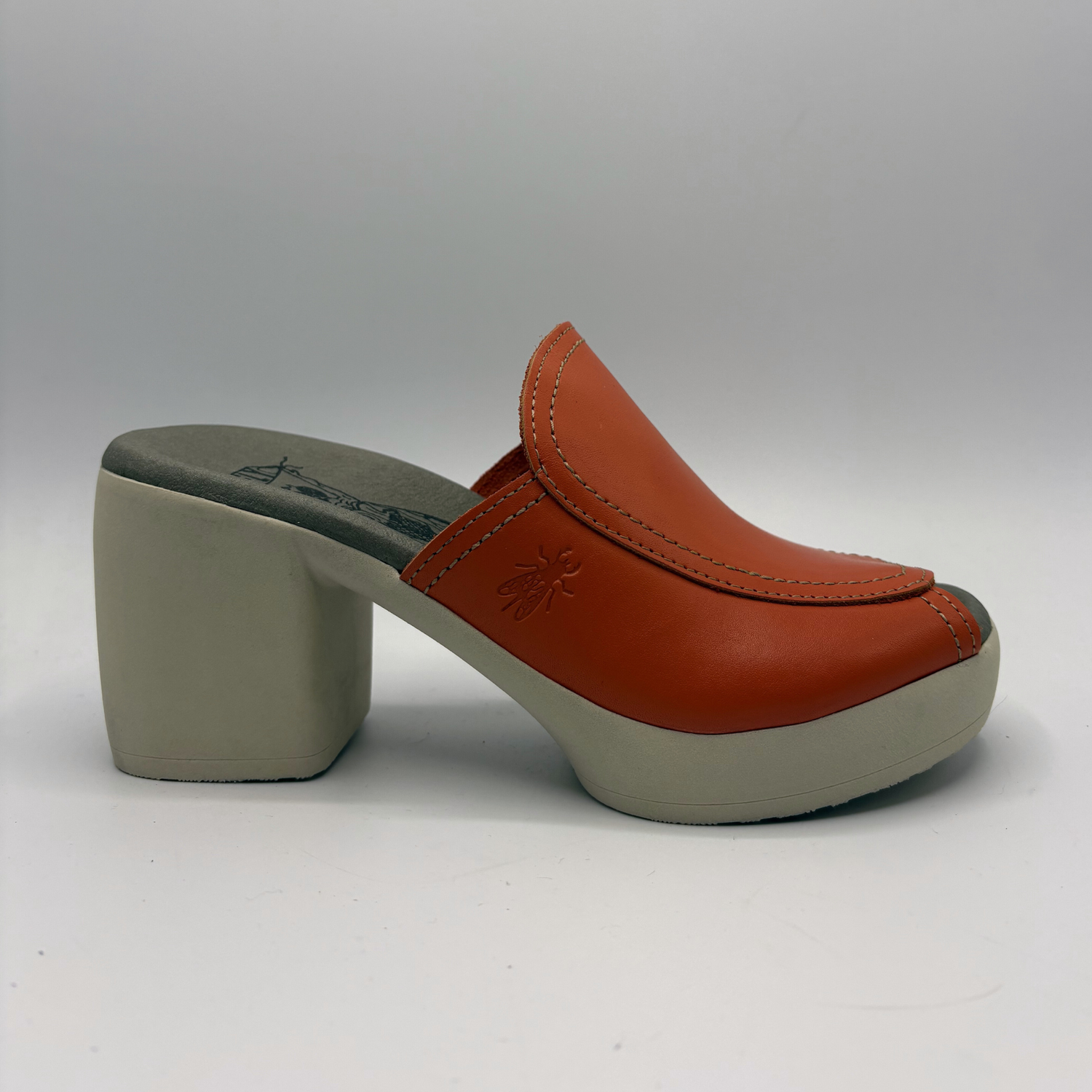 Orange clog shoe on a white background