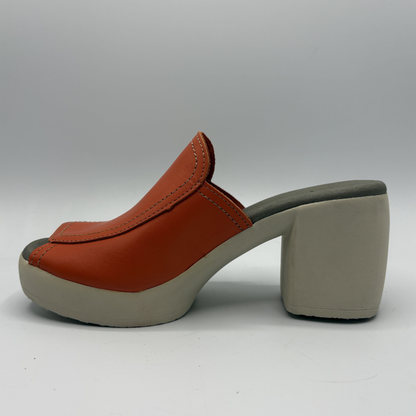 Orange leather clog shoe on a white background