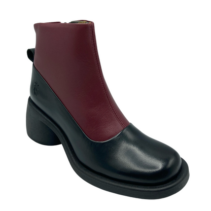 45 degree angled view of black and red leather boot with chunky heel