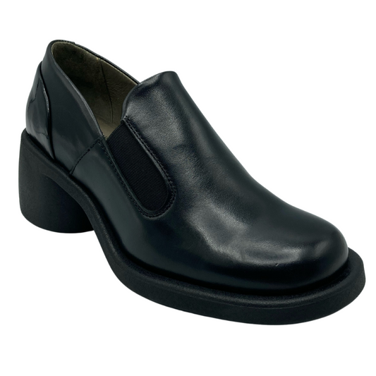 45 degree angled view of black leather loafer with chunky black heel