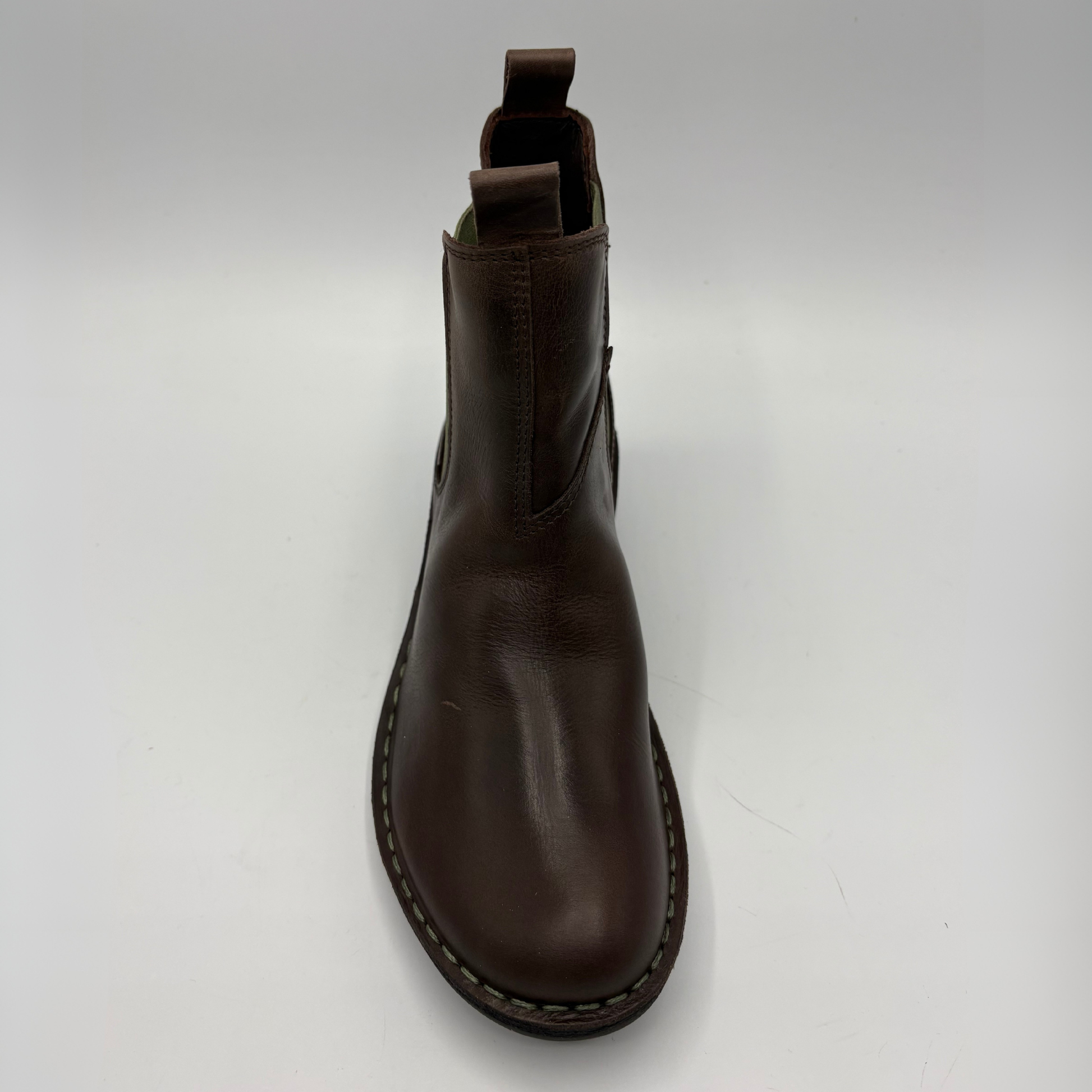 A dark brown leather Chelsea boot shown from a top-down perspective on a light gray background.