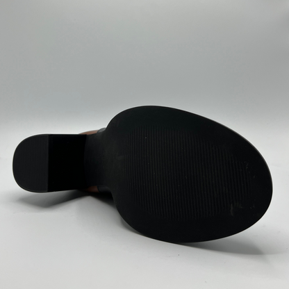 Black shoe sole on a gray background
