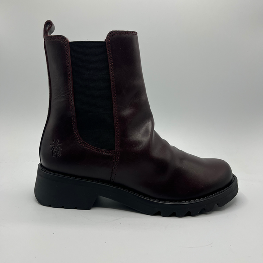 Wine leather boot on a white background
