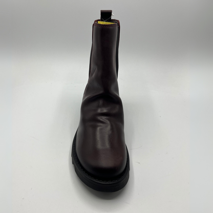 Wine leather boot on a white background