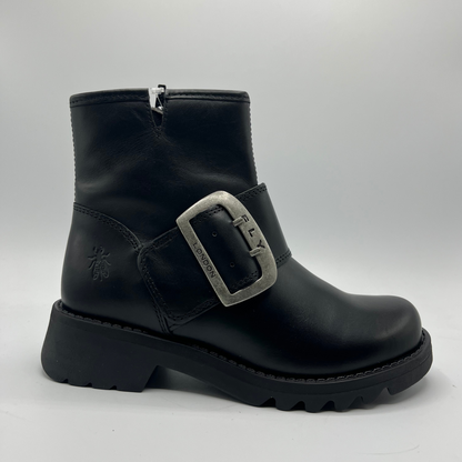 Black boot with a silver buckle on a light gray background