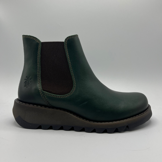 Green Chelsea boot on a gray background
