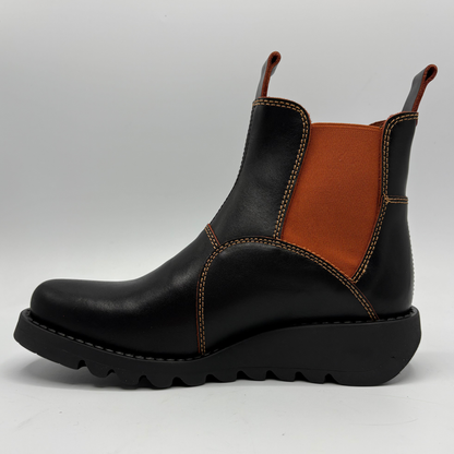 A black leather ankle boot with a contrasting brown elastic side panel and orange-brown contrast stitching, shown from a side profile on a light gray background.