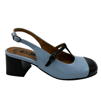 Right facing view of sky blue patent leather sandal with block heel and t strap