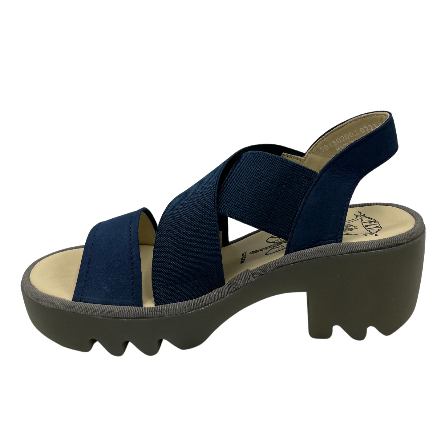 Left facing view of navy blue stretchy strapped sandal with lugged rubber outsole and rounded toe