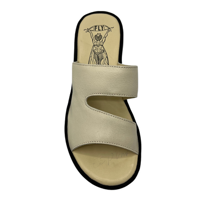 Top view of off white leather sandal with chunky black rubber outsole