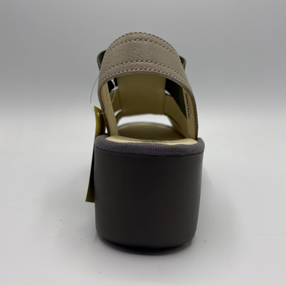 Brown sandal with a platform sole on a white background