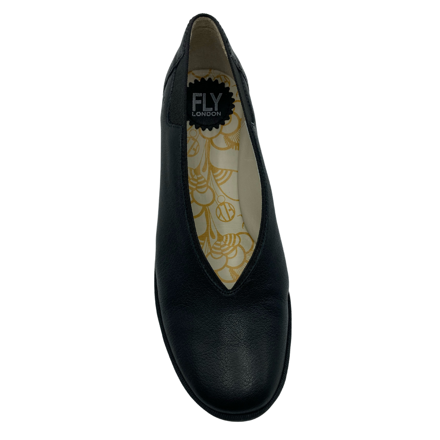 Top down view of black leather shoe with white and orange design on insole