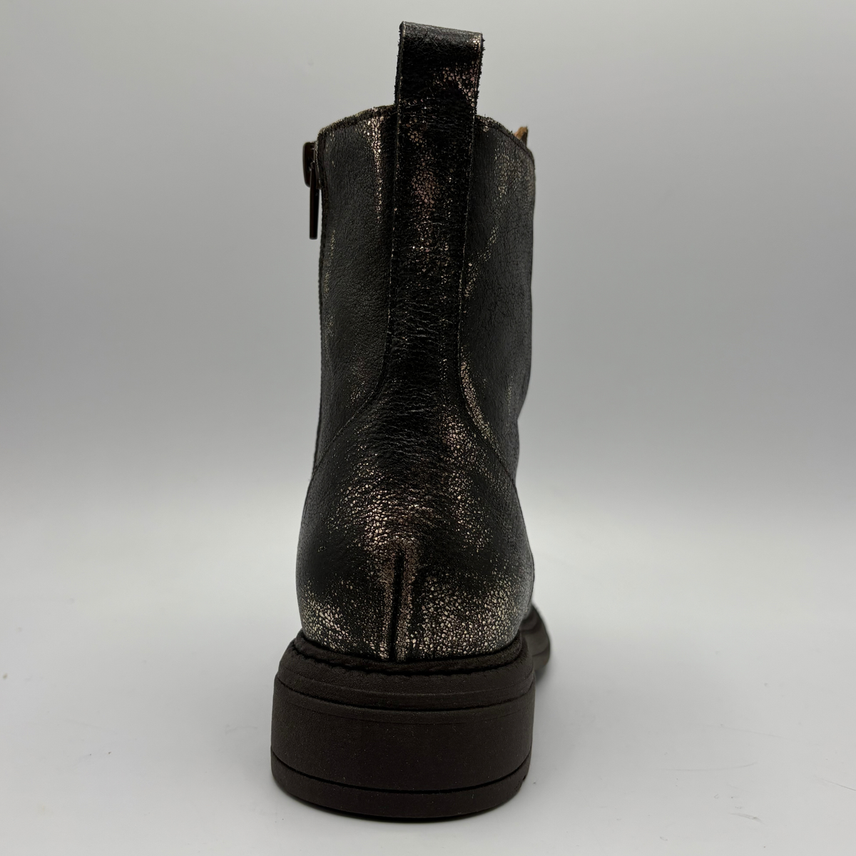 Back  view of a weather look leather boot with a leopard print tongue