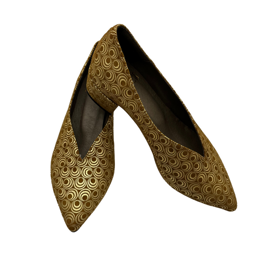 Upper view of a pair of low heeled pumps with a pointed toe and wrapped heel.