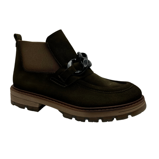 45 degree angled view of khaki suede short boot with rubber lug sole, elastic side gores and moccasin style details.