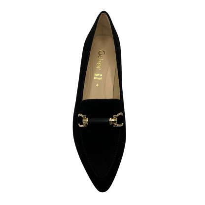 Top view of black suede heeled shoe with gold and black detail on upper. Pointed toe and wrapped heel.