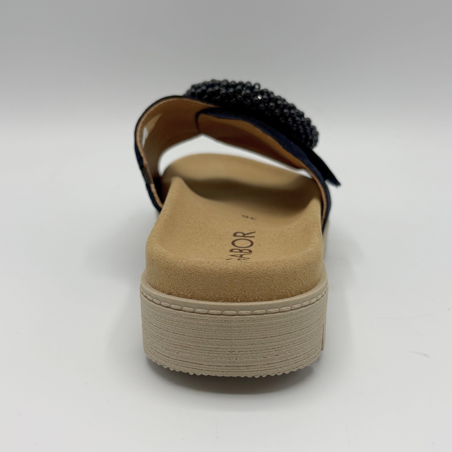 Navy sandal with a platform sole on a white background