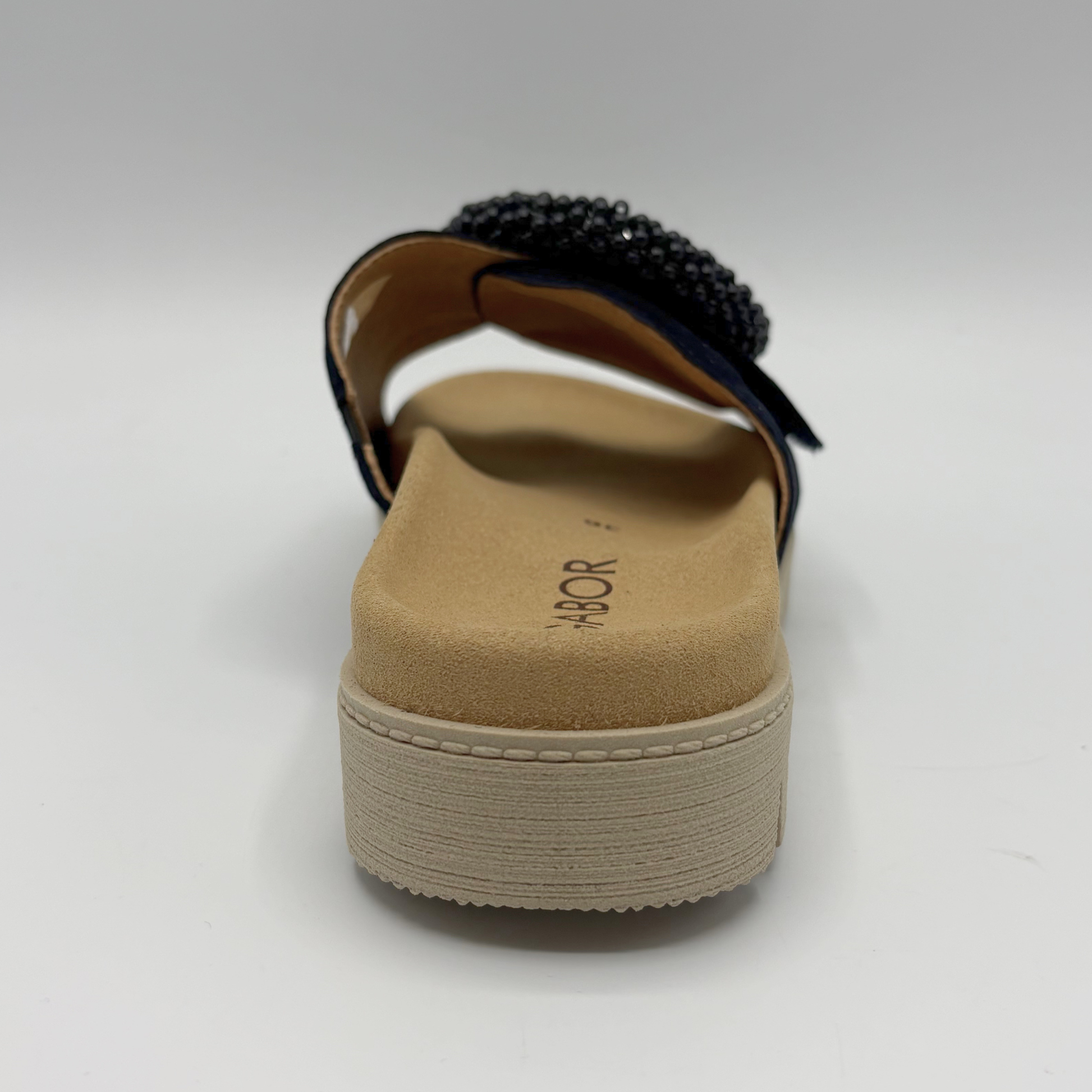 Navy sandal with a platform sole on a white background
