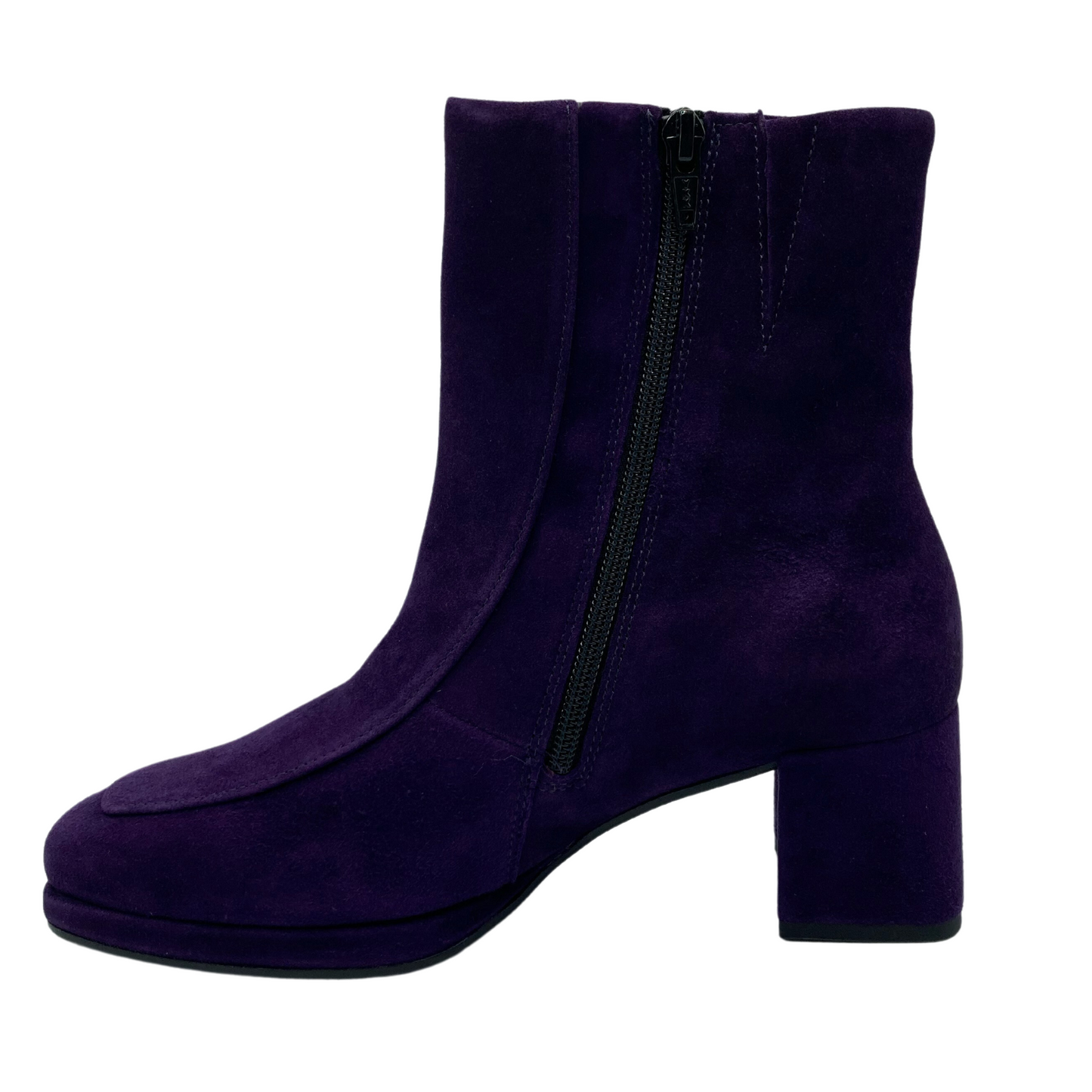 Left facing view of purple suede short boot with block heel with side zipper closure