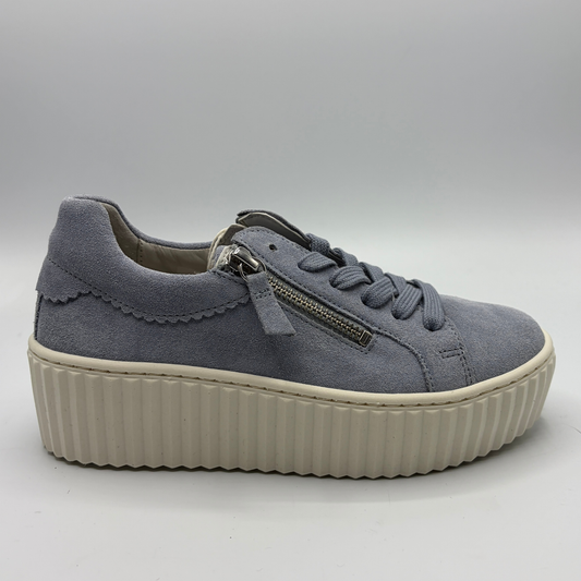 Gray sneaker with a platform sole on a light gray background