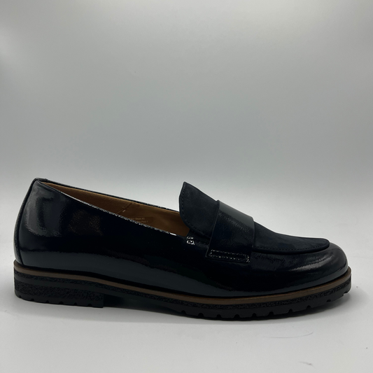 Right facing view of a black leather loafer with a tan lining