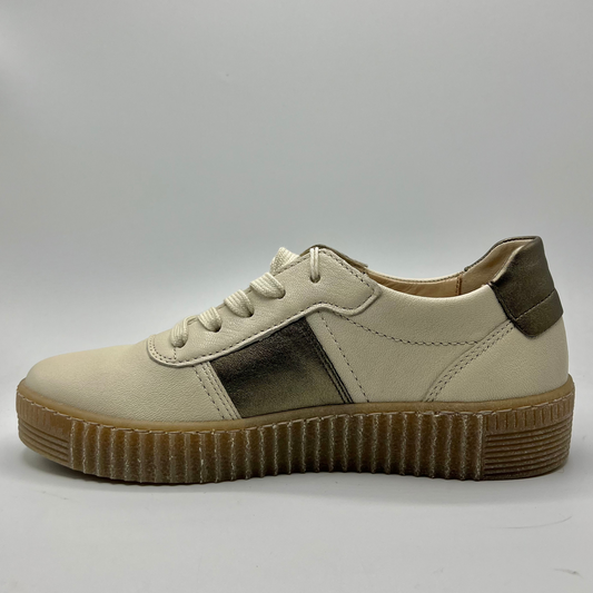 Left facing view of a beige leather shoe with metallic accents and a lace up design