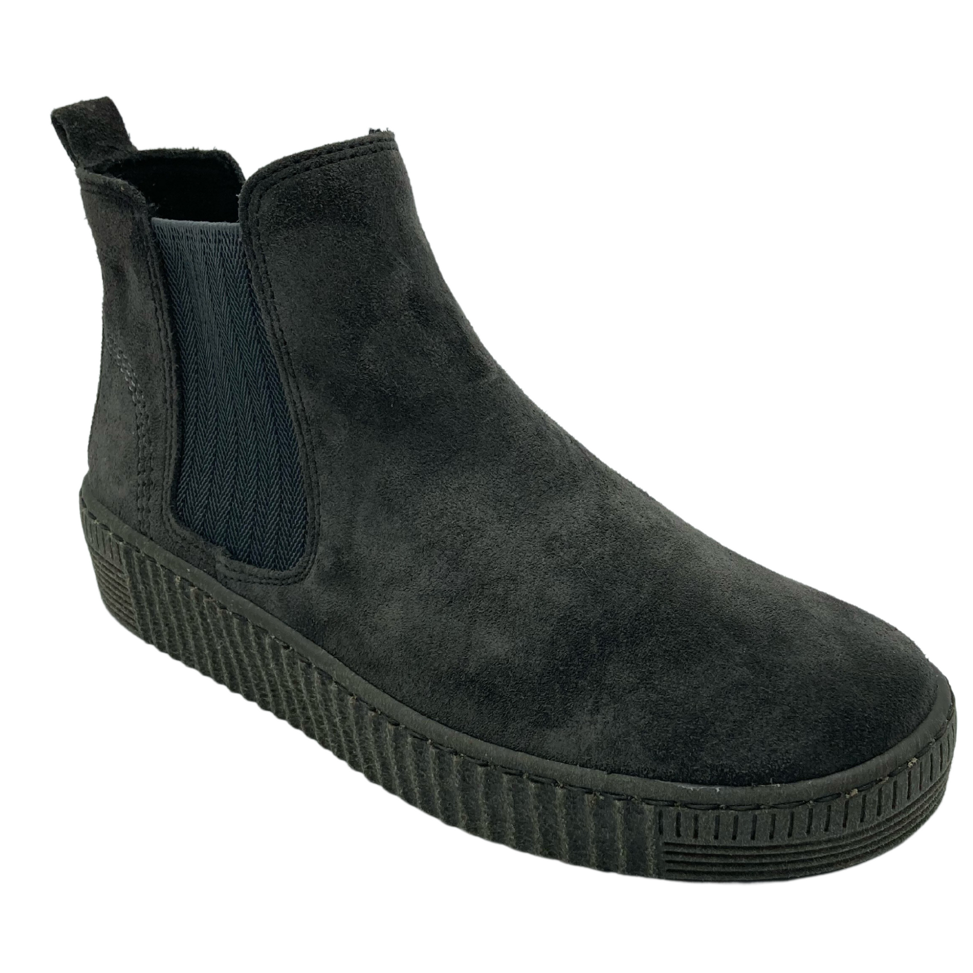 45 degree angled view of grey suede ankle bootie with elastic side gore and pull-on heel tab