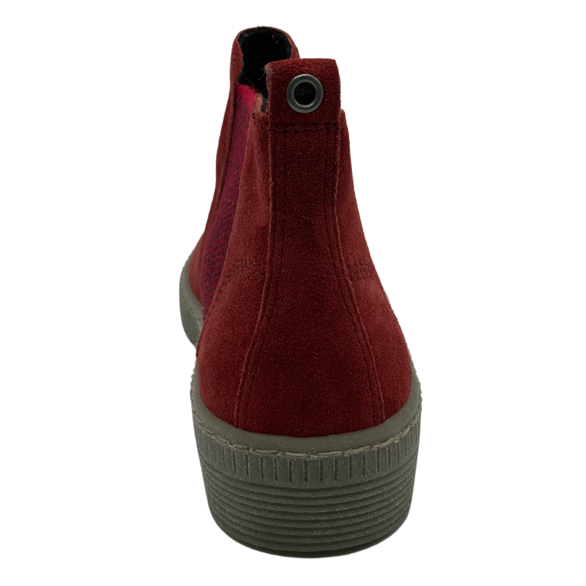 Heel view of red suede bootie with rubber sole and pull tab with a silver grommet