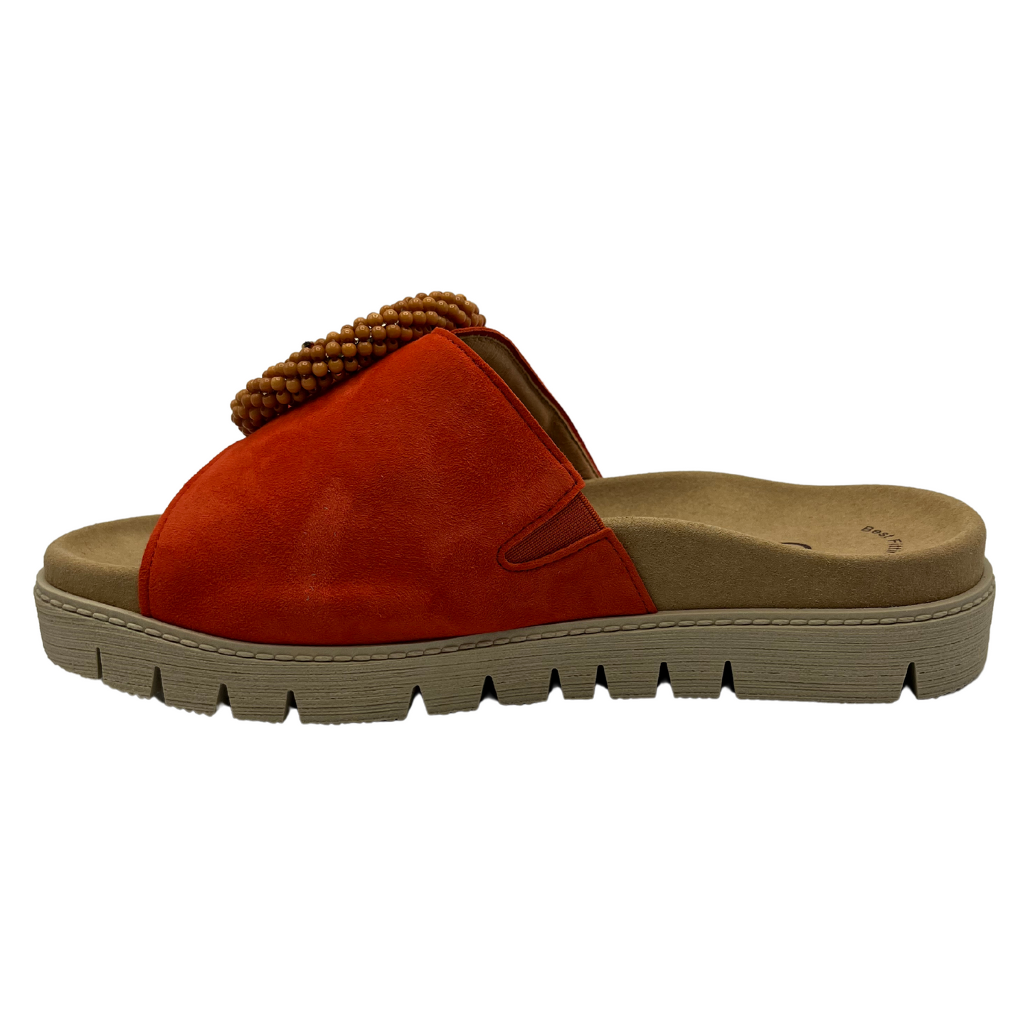 Left facing view of orange suede slide with large buckle detail and anatomical footbed