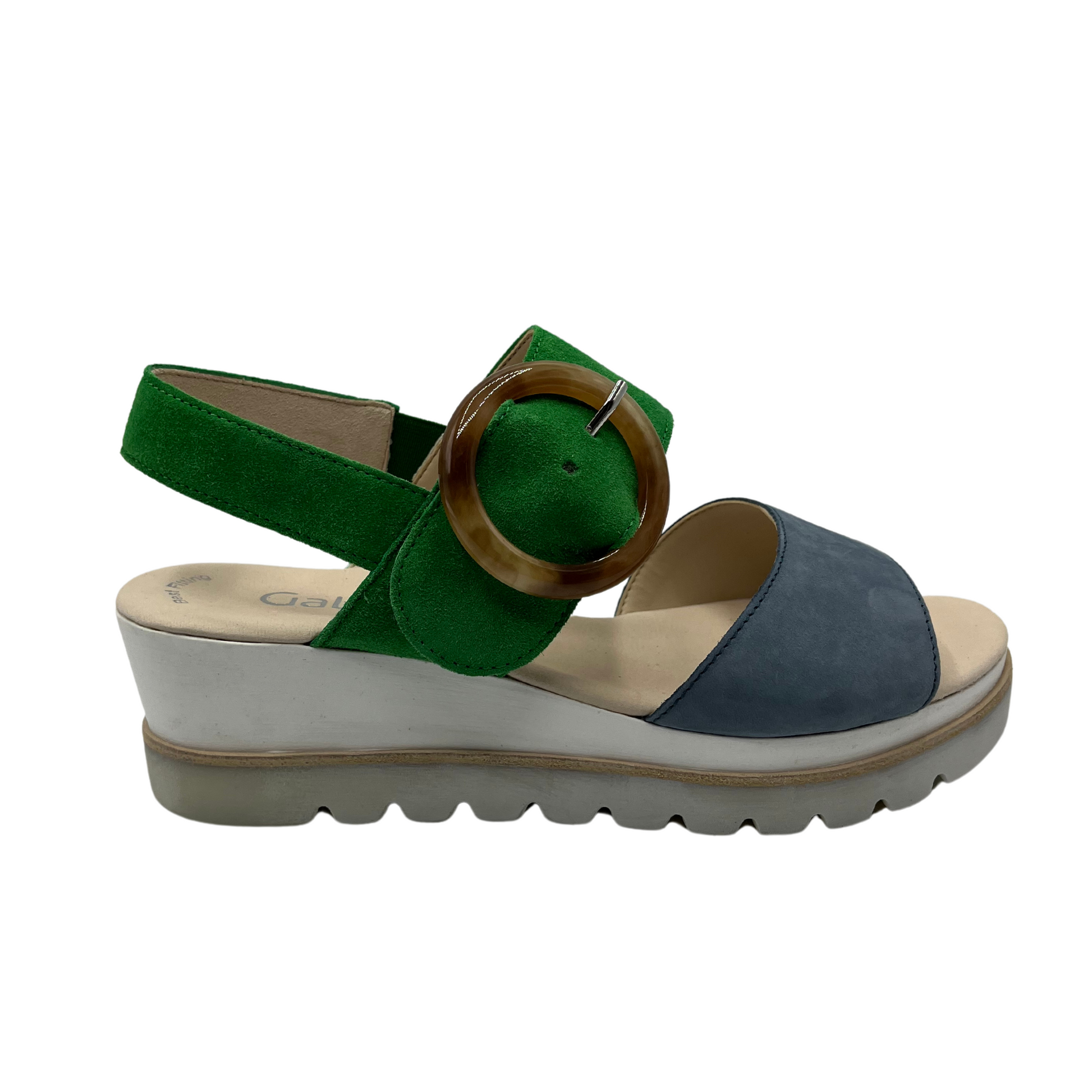 Right facing view of green and blue wedge sandal with round buckle strap and open toe